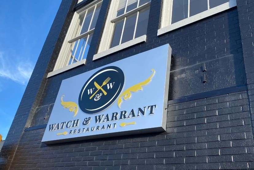 Watch and Warrant building signage